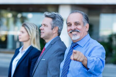 Senior businessman with son and daughterの写真素材