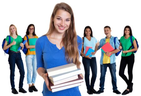 Laughing german female student with books and group of studentsの写真素材