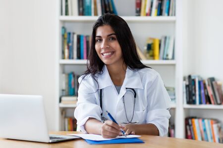Laughing latin american female gynecologistの写真素材