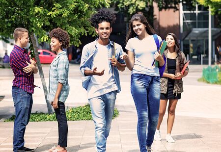 Group of talking students in cityの写真素材