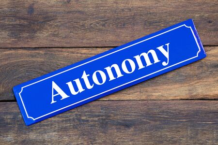 Autonomy street sign on wooden backgroundの写真素材