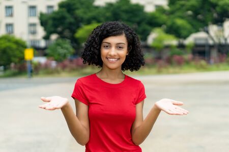 Happy latin american woman looking at camera