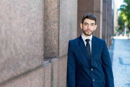 Handsome hipster businessman with beard and suitの写真素材