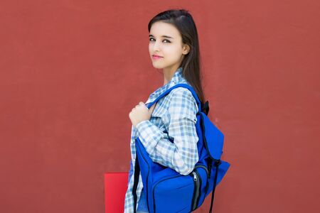 Portrait of caucasian female student with backpack