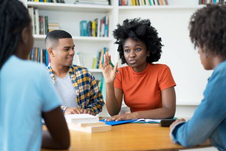 Group of talking brazilian and african american students