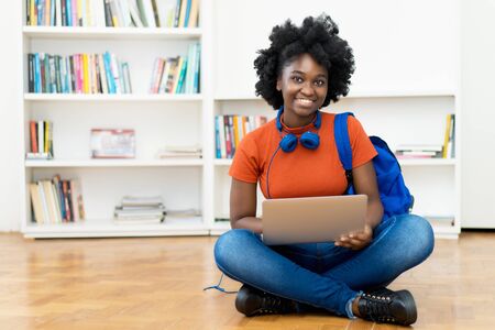 Video call of african american female student at computerの写真素材