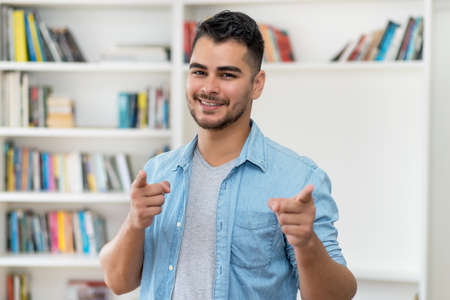 Young hispanic hipster man with beard and casual clothesの写真素材
