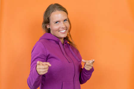 Pretty blond german young adult woman with hoodyの写真素材
