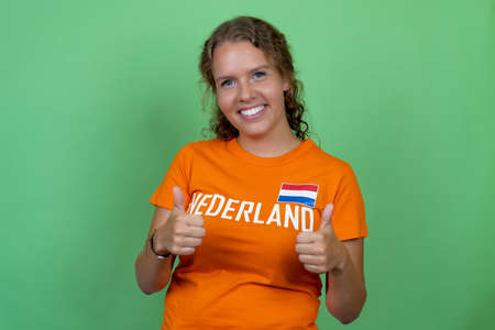 Happy blond female soccer fan from Netherlands