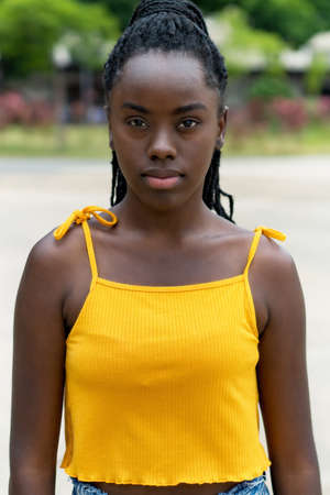 Serious african american young adult woman with dreadlocksの写真素材