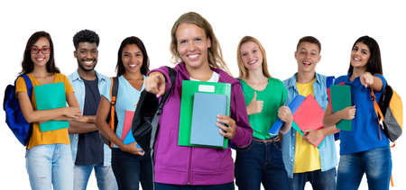 Beautiful german young adult woman with large group of international studentsの写真素材