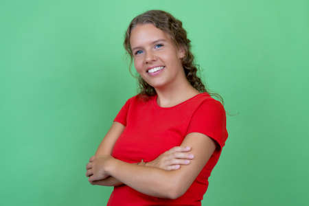 Laughing blond woman with red shirtの写真素材