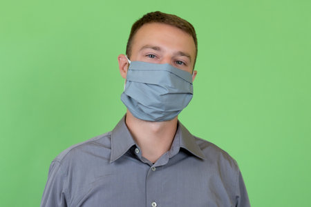 Portrait of a german man with fashionable face mask as protection against corona virus infectionの写真素材