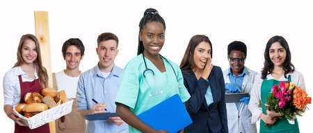 Young african american female nurse with group of trainees isolated on white background for cut outの写真素材