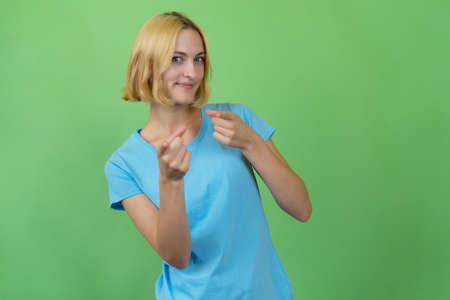 Cool young woman with colored blond hairの写真素材