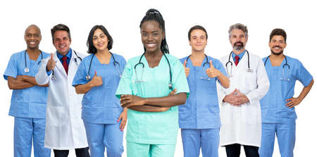 Happy african american female nurse with doctor and medical teamの写真素材