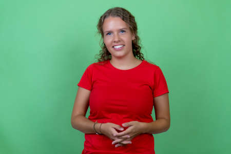 Modern young woman with red shirt and brunette hairの写真素材