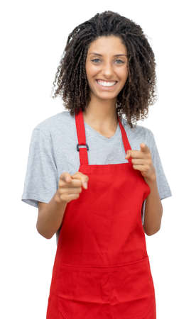 Beautiful waitress or female clerk with curly hair and red apron isolated on white background for cut outの写真素材