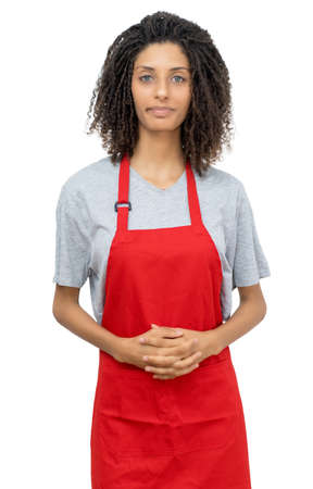 Young waitress or female clerk with curly hair and red apron isolated on white background for cut outの写真素材