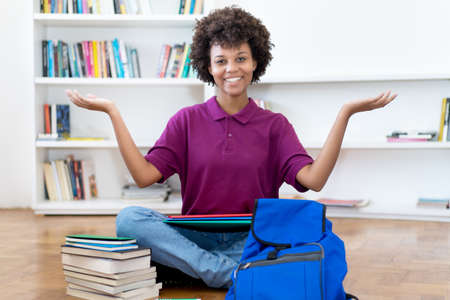 Successful african american female college student indoors at homeの写真素材