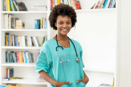 Pretty afro american female nurse at work at hospitalの写真素材