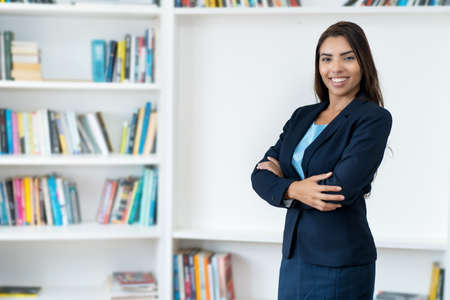 Beautiful mexican female business trainee at the office of companyの写真素材