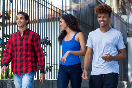 Brazilian and mexican hipster young adults in city in summer