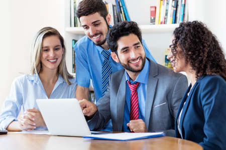 Motivated multi ethnic team of male and female business trainees