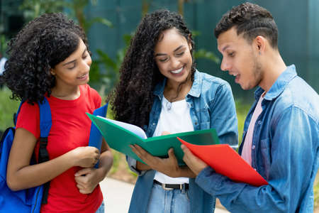 Group of learning brazilian and caucasian and latin american students at campus of universityの写真素材