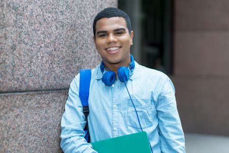 Young brazilian male student with retainer outdoor in the cityの写真素材