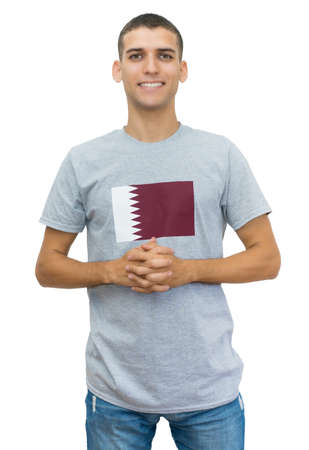 Handsome soccer fan with flag of Qatar on jerseyの写真素材