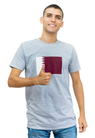 Laughing soccer fan with flag of Qatar on jerseyの写真素材