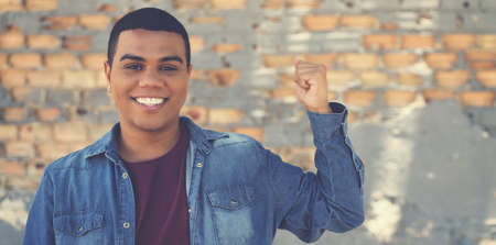 Successful latin american hipster young adult in urban city styleの写真素材