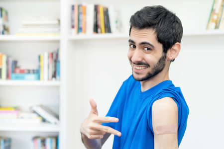 Happy arabic man after third vaccinationの写真素材