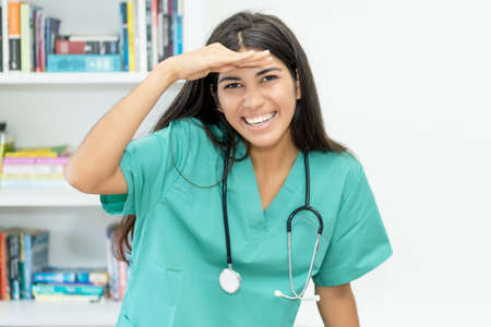 Laughing south american female nurse or doctor at hospitalの写真素材