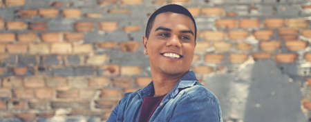 Handsome latin american hipster young adult in urban city styleの写真素材