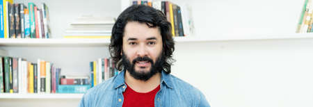 Portrait of strong man with full beard indoors at homeの写真素材