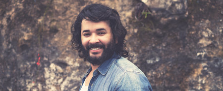 Laughing powerful man with full beard outdoor in urban styleの写真素材