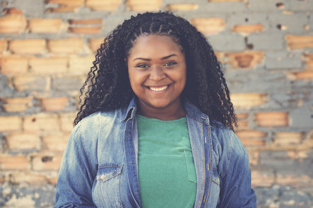 Pretty corpultent african american female young adult outdoor in urban city styleの写真素材