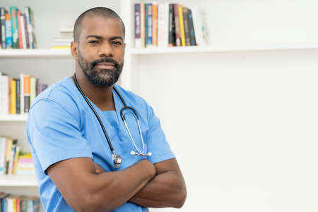 Serious african american mature nurse or doctor at office of hospitalの写真素材