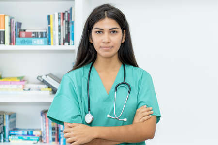 Portrait of serious south american female nurse or doctor at hospitalの写真素材