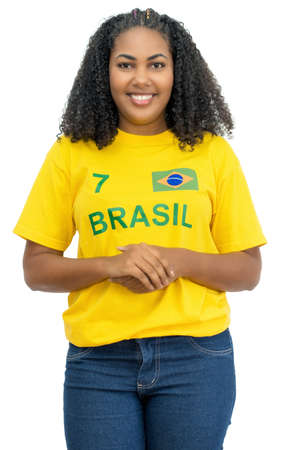 Laughing brazilian female soccer fan isolated on white background for cut outの写真素材