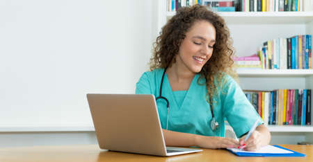 Learning medical student or female nurse at work at hospital with copy spaceの写真素材