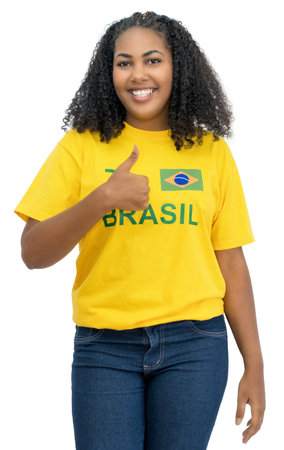 Optimistic brazilian female soccer fan isolated on white background for cut outの写真素材