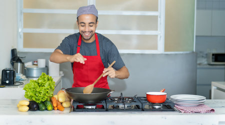 Happy tunisian chef preparing traditional food of restaurantの写真素材