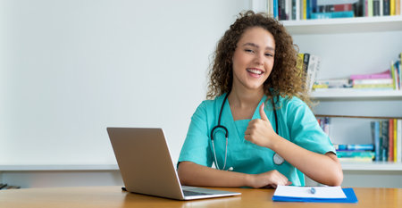 Motivated medical student or female nurse at work at hospital with copy spaceの写真素材