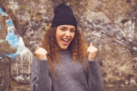 Hipster girl with knit hat - concept success in urban styleの写真素材