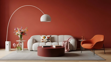 Living room showing cozy living room with beige sofa, red wall, and arched floor lamp. Clear details and vibrant colors enhance visual appeal. living room, interior home decor, beige sofa.の写真素材