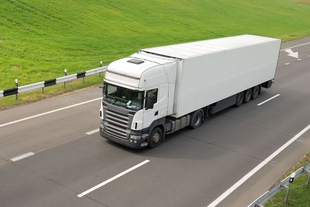 upper view of white lorry with trailer on the highwayの写真素材