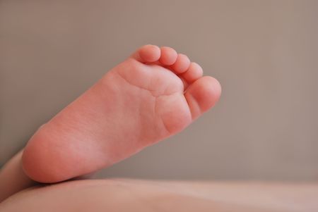 Single foot of newborn babyの写真素材